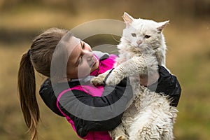 Ten-year girl playing with a stray cat. Love.