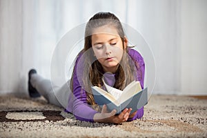 Ten years old girl with a books