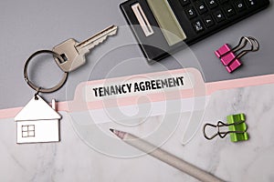 Tenancy Agreement. File folder, stationery and home keys photo