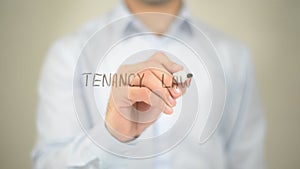 Tenancy Law , man writing on transparent screen photo