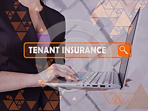 TENANT INSURANCE text in search bar. Loan officer looking for something at laptop. TENANT INSURANCE concept