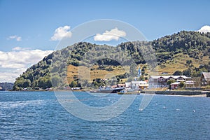 Tenaun skyline with Church on background - Tenaun, Chiloe Island, Chile photo