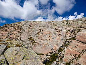 Tende - Close up view of red marble rock formation in Mercantour National Park in the Valley of Marvels