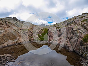 Tende - Panoramic view of small glacier pond in the Mercantour National Park in the Valley of Marvels near Tende