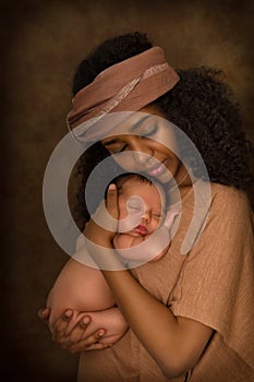 Tender African mother holding baby