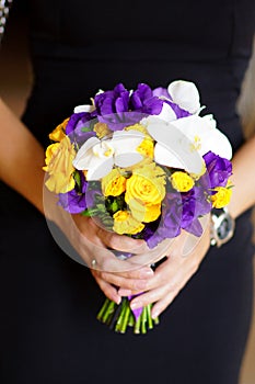Tender beautiful bridal bouquet in the hands