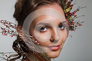 Tender beauty portrait of bride with roses wreath in hair