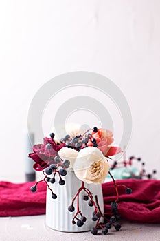Tender colorful roses  flowers and wild fall berries on textured background