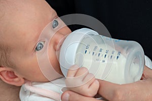 Tender Fatherly Moments: Bottle-Feeding Newborn