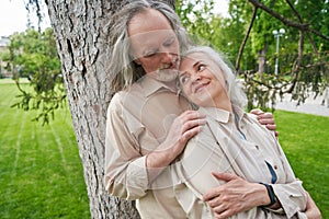 Tender female person leaning on her husband