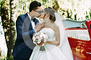Tender kiss of the two in their wedding day