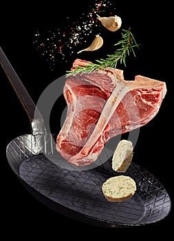 Tender lean T-bone steak floating in air