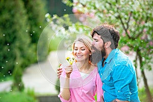 Tender love feelings. Man and woman in blooming garden. Smiling couple in love on blossoming tree garden background.