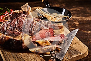 Tender medium rare steak with knife photo