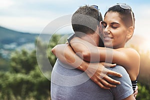 Tender moments filled with love. a young couple in a loving embrace outdoors.