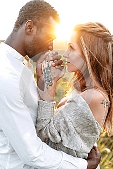 Tender multiracial couple in love outdoor
