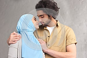 tender muslim couple going to kiss
