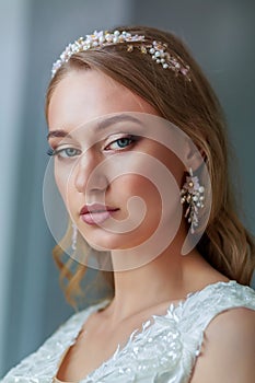 Tender portrait of a beautiful woman bride, wedding make-up