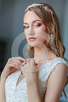 Tender portrait of a beautiful woman bride, wedding make-up