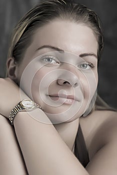 Tender smile woman with wrist watch in the daylight