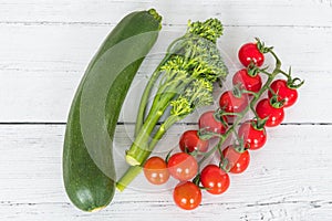 Tender stem Broccoli a small string of tomatoes and a Single Courgette