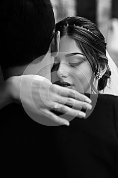 Tender warm embracement of the married couple