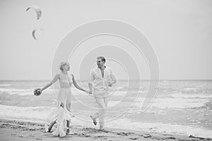 Tender wedding couple on beach