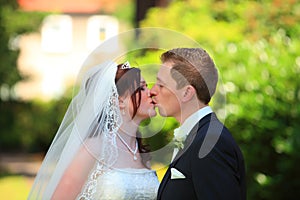 Tender wedding kiss