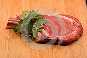 Tenderized Steak on a Wooden Cutting Board