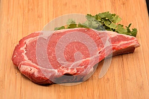 Tenderized Steak on a Wooden Cutting Board