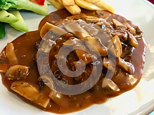 Tenderloin Meat with Demi Glace Sauce, Mushrooms, Potatoes and Boiled Fresh Vegetables at Restaurant