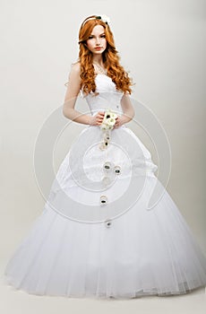 Tenderness. Redhaired Exquisite Bride in White Bridal Dress. Wedding Fashion Collection