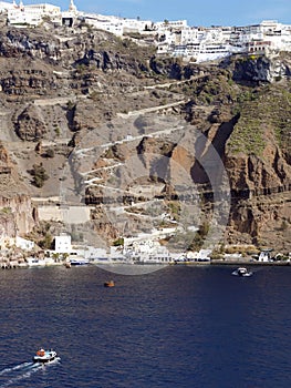 Tenders ferry passengers from cruise ship to  Santorini