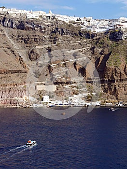 Tenders ferry passengers from cruise ship to  Santorini