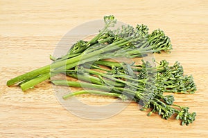 Tenderstem broccoli on a board