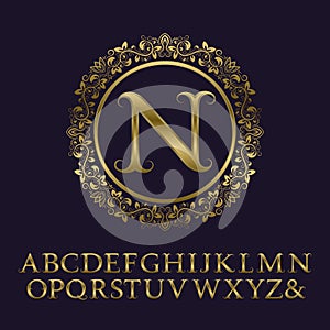 Tendrils gold letters with N initial monogram.