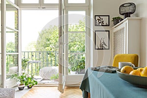 Tenement house with a balcony decorated with plants.