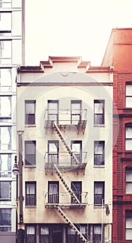 Tenement house with fire escape in Manhattan, color toning applied, New York City, USA