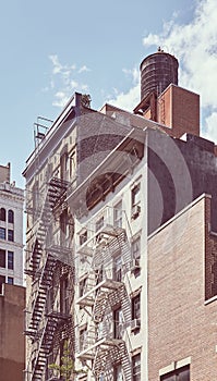 Tenement houses with fire escape in Manhattan, color toning applied, New York City, USA