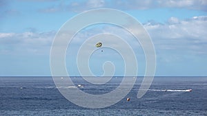 Tenerife, Spain - 29. July 2023: Boats and other vehicles doing watersports on the blue atlantic ocean