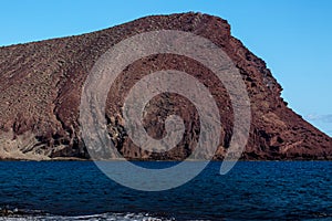 Tenerife, Tejita Beach and Montana Roja   clear volcanic rock texture to red volcanic sand