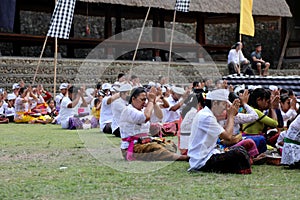 Villagers gather for prayers ahead of the annual Perang Pandan festival in the Balinese