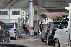 Tenggarong, Indonesia, December 2023, Cars queue line waiting for petrol in gas station