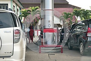 Tenggarong, Indonesia, December 2023, Cars queue line waiting for petrol in gas station