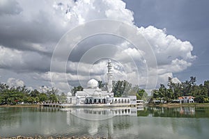 Kuala Ibai Floating Mosque or Masjid Tengu Tengah Zaharah and its reflection in the water. photo