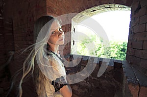 Tennage girl inside ruins