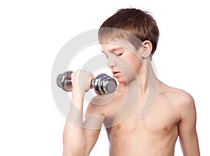 Tennager holds dumbbell photo