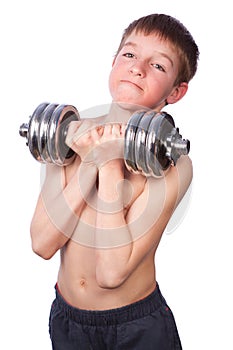 Tennager lifts heavy dumbbell photo