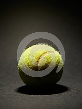 Tennis ball on black background