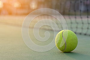 Tennis ball on net background